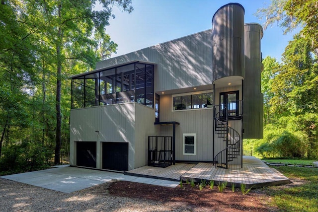 rear view of house featuring a garage