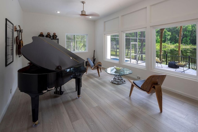 sitting room featuring recessed lighting, wood finished floors, and baseboards