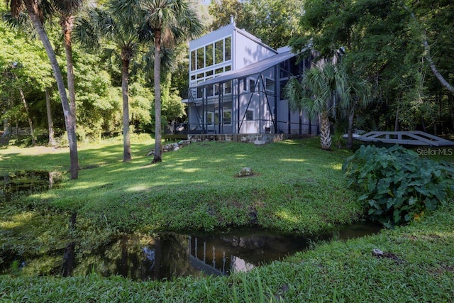 view of yard featuring glass enclosure