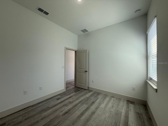 spare room with light wood-type flooring