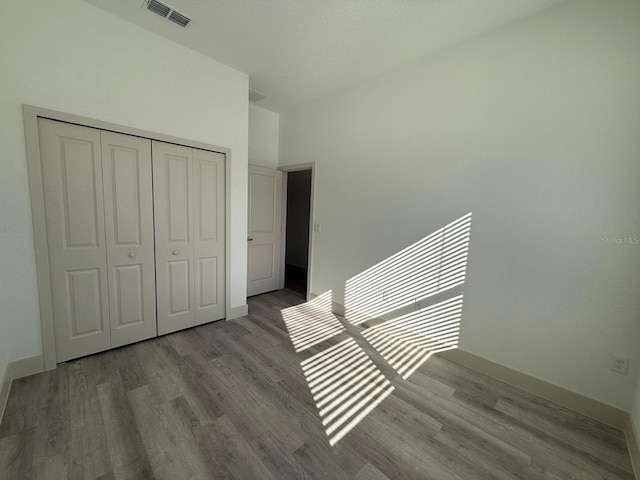 interior space with light hardwood / wood-style flooring and a closet