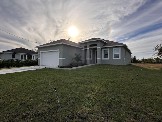 single story home with a yard and a garage