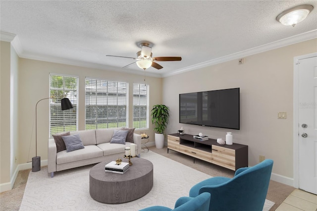 living room featuring a textured ceiling, ornamental molding, and a ceiling fan