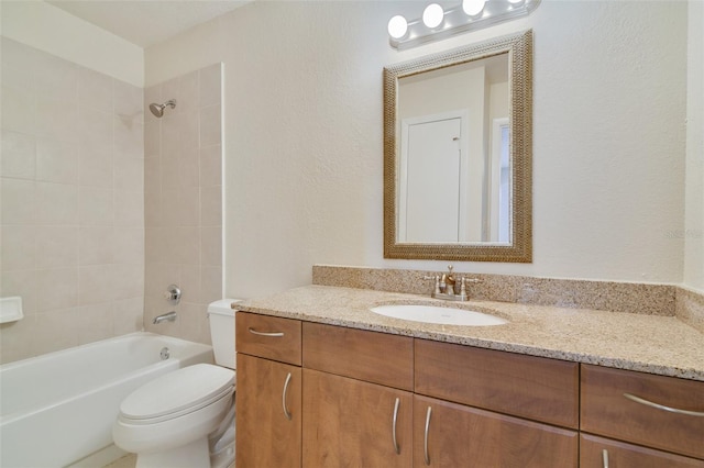 full bath with shower / bathtub combination, a textured wall, vanity, and toilet