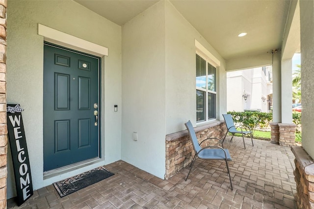 property entrance featuring covered porch