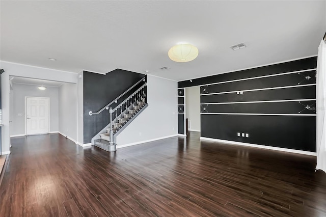 unfurnished living room featuring dark hardwood / wood-style flooring