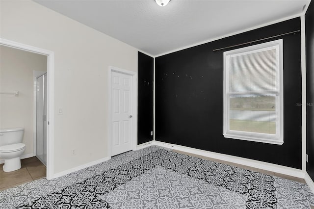 unfurnished room featuring a textured ceiling