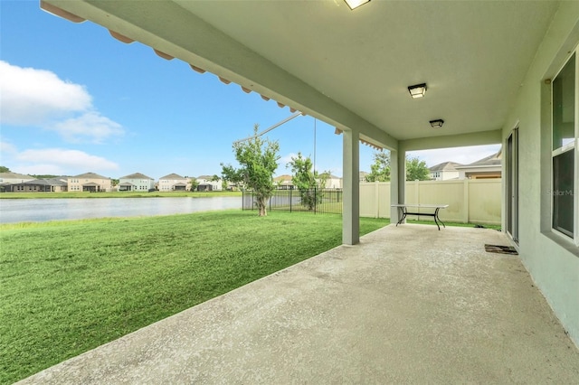 view of patio featuring a water view