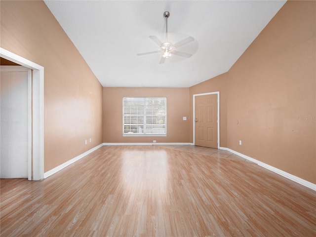 unfurnished room with light wood-type flooring, vaulted ceiling, and ceiling fan