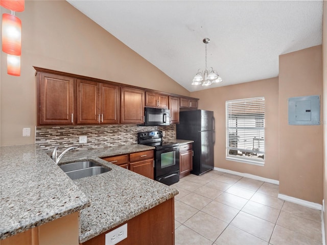 kitchen with sink, black appliances, kitchen peninsula, decorative light fixtures, and lofted ceiling