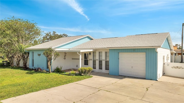 ranch-style house with a garage and a front yard