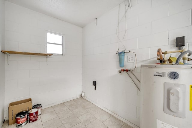 laundry area with water heater