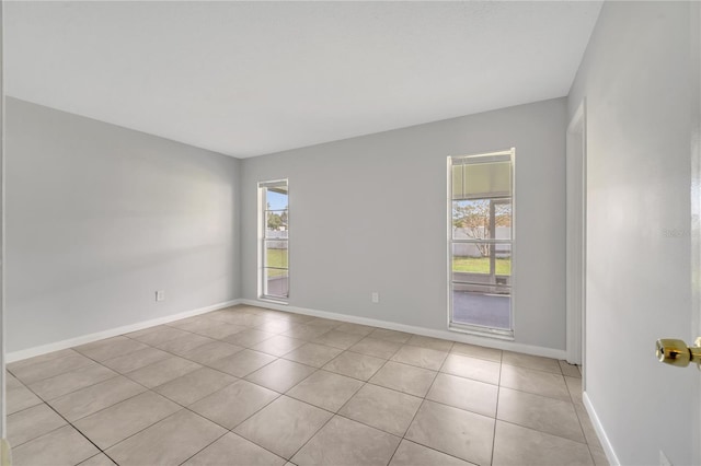 empty room featuring light tile patterned floors