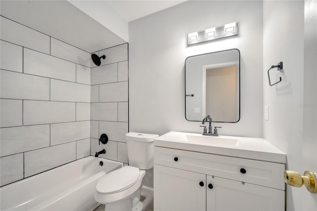 full bathroom featuring toilet, tiled shower / bath combo, and vanity