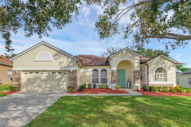 view of front facade with a garage and a front yard