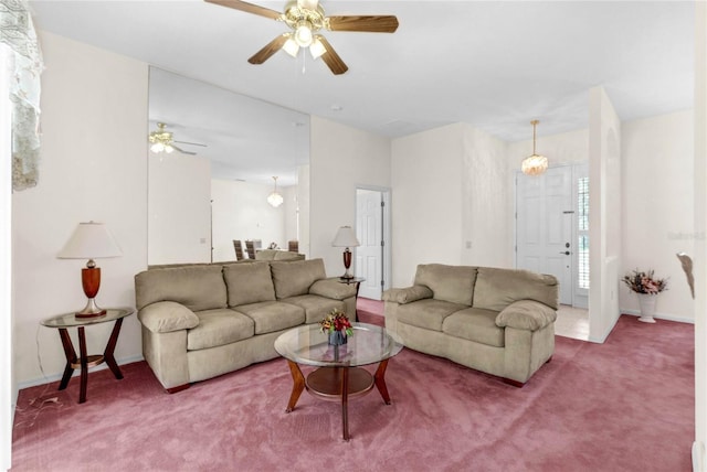 living room with ceiling fan and carpet