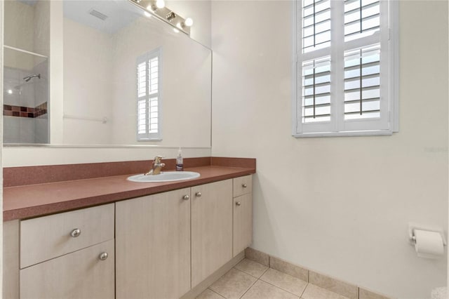 bathroom with vanity and tile patterned floors