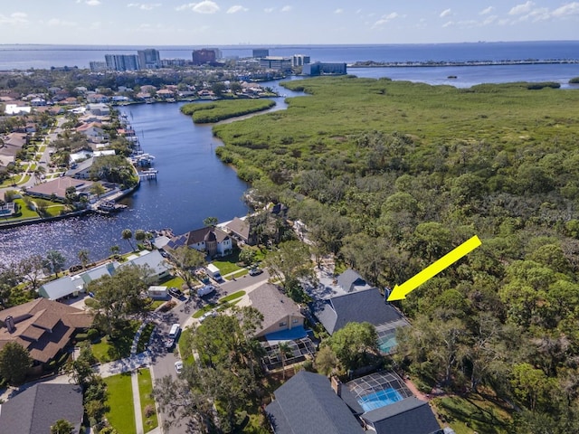 birds eye view of property with a water view