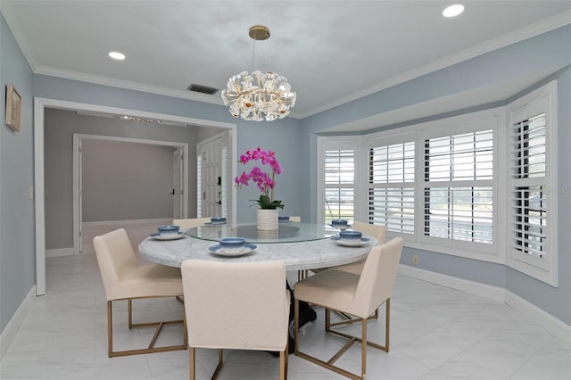 dining space with ornamental molding and an inviting chandelier