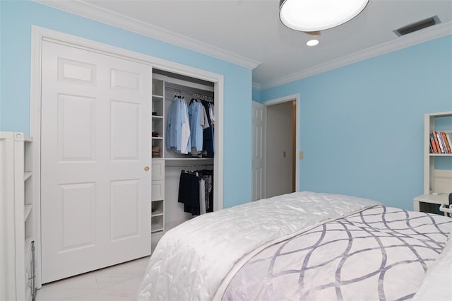 bedroom with ornamental molding and a closet