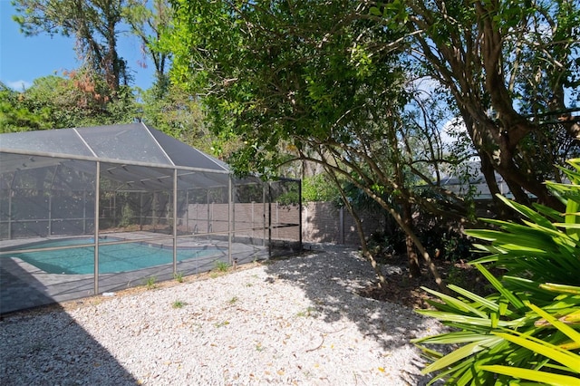 view of pool featuring a lanai