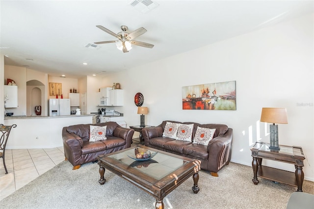 living room with light carpet and ceiling fan