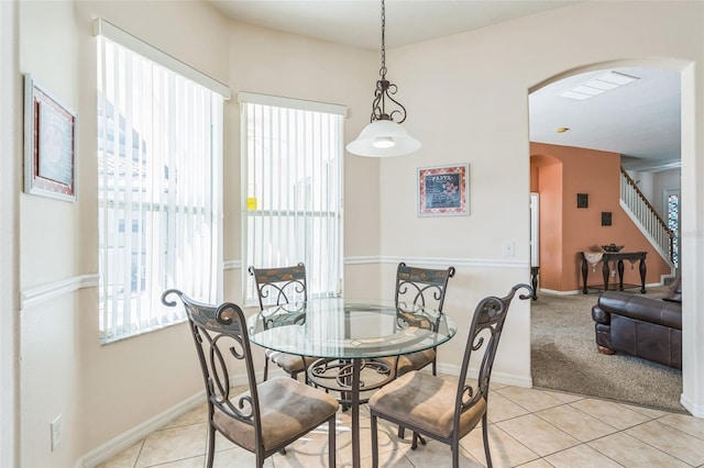 tiled dining room featuring a wealth of natural light