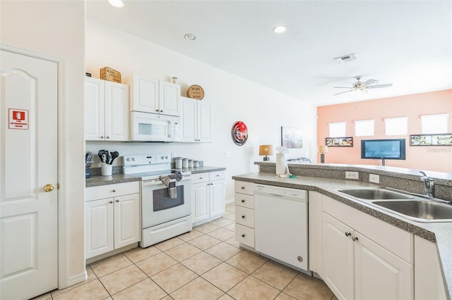 kitchen featuring white cabinets, sink, light tile patterned floors, ceiling fan, and white appliances