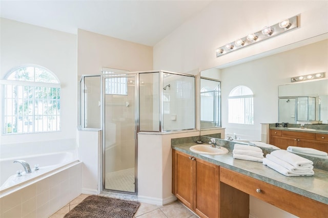 bathroom featuring vanity, tile patterned flooring, and shower with separate bathtub