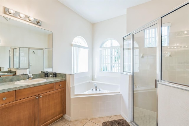 bathroom with vanity, tile patterned floors, and separate shower and tub