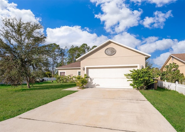 view of front of home featuring a garage and a front lawn