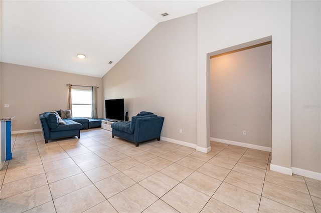 living room featuring high vaulted ceiling and light tile patterned flooring