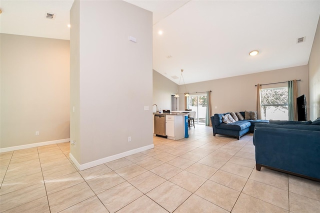 tiled living room featuring vaulted ceiling