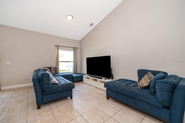 tiled living room with high vaulted ceiling