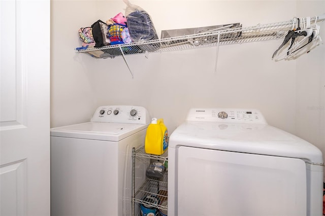 laundry area with independent washer and dryer