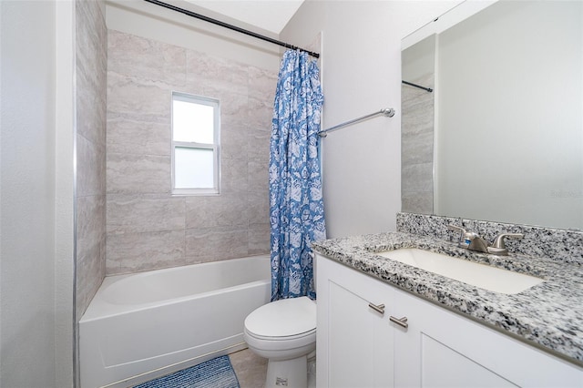 full bathroom featuring toilet, vanity, shower / bath combo with shower curtain, and tile patterned flooring