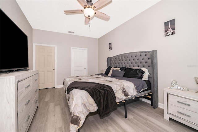 bedroom featuring light hardwood / wood-style floors and ceiling fan