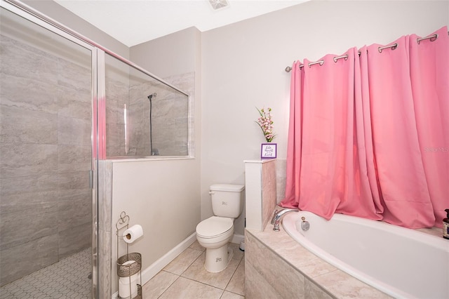 bathroom with toilet, tile patterned floors, and separate shower and tub