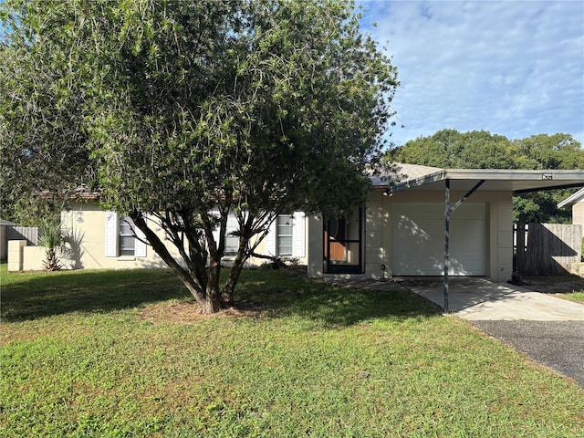 view of front of house with a garage, a front lawn, and a carport