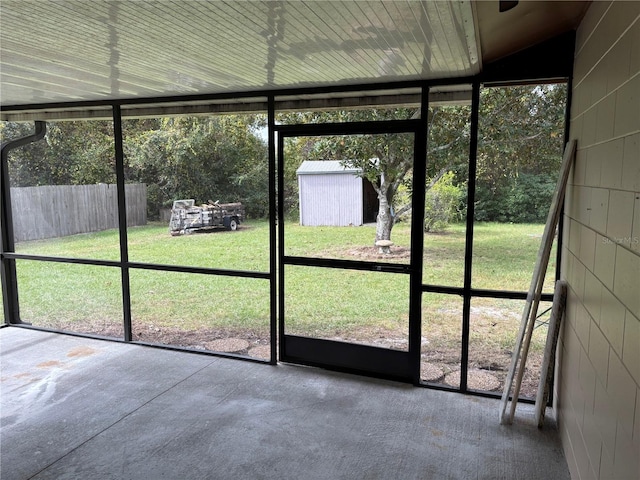 unfurnished sunroom with vaulted ceiling and a healthy amount of sunlight