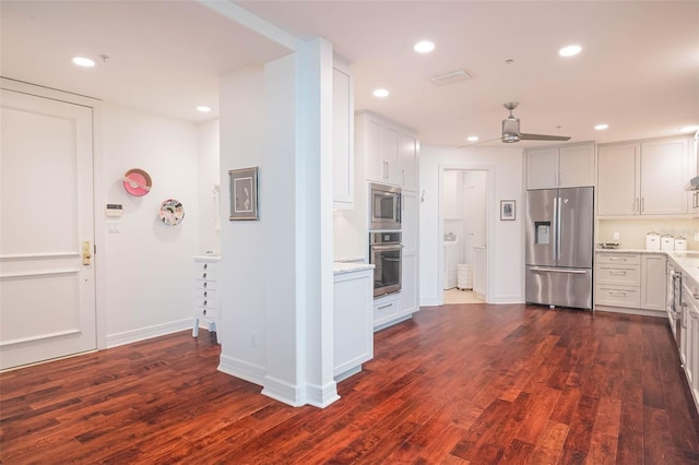 kitchen featuring ceiling fan, dark hardwood / wood-style flooring, white cabinetry, and appliances with stainless steel finishes