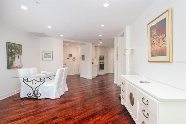 dining area featuring dark hardwood / wood-style floors