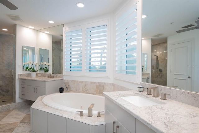 340 S Palm Ave Unit 11, Sarasota, FL 34236 - full bathroom with a stall shower, two vanities, a tub with jets, and recessed lighting