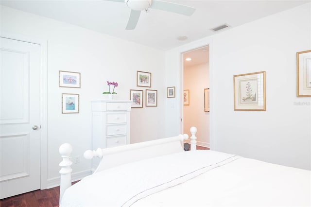 bedroom featuring ceiling fan and dark wood-type flooring