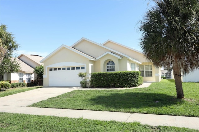 ranch-style house featuring a front lawn and a garage