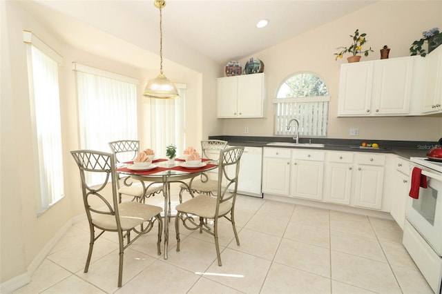 kitchen featuring light tile patterned flooring, white cabinetry, sink, decorative light fixtures, and white appliances