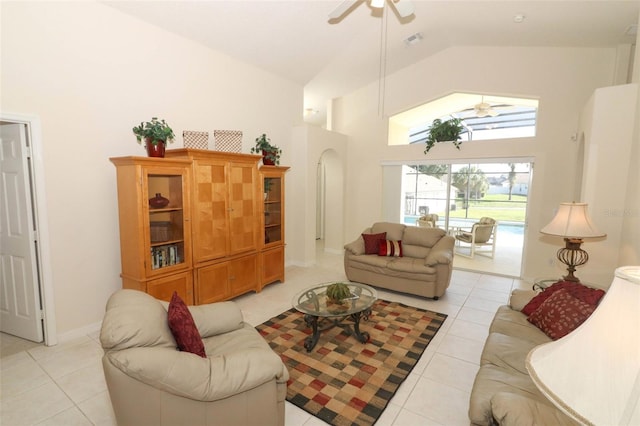 living room with high vaulted ceiling, ceiling fan, and light tile patterned flooring