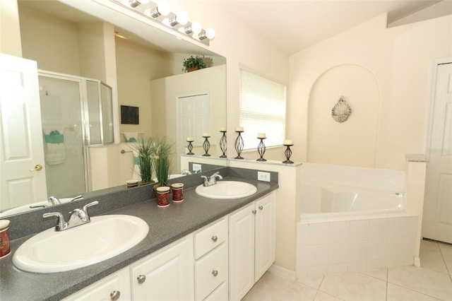 bathroom with tile patterned flooring, vanity, and independent shower and bath