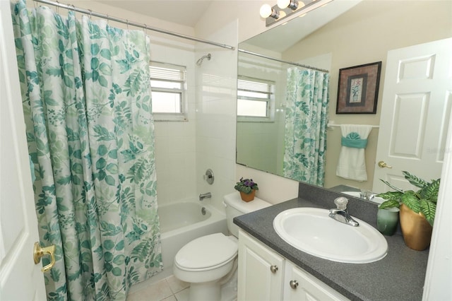 full bathroom featuring vanity, tile patterned floors, toilet, and shower / tub combo