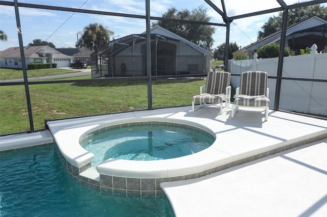 view of pool featuring a lanai, a patio, an in ground hot tub, and a yard